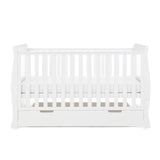 Sleigh cot bed with curved edges, solid  ends, teething rails fitted on the sides, base on the middle setting, under drawer included with cut out open handles. 