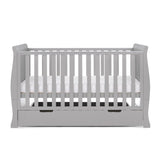 sleigh cot bed with curved edges, solid ends & teething rails on the side rails, base set on the middle level. 