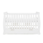 Sleigh Cot Bed with curved edges, solid ends, teething rail on the sides, base on new born setting. Under drawer included with cut out handles. 