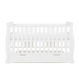 Sleigh Cot Bed with curved edges, solid ends, teething rail on the sides, base on new born setting. Under drawer included with cut out handles. 