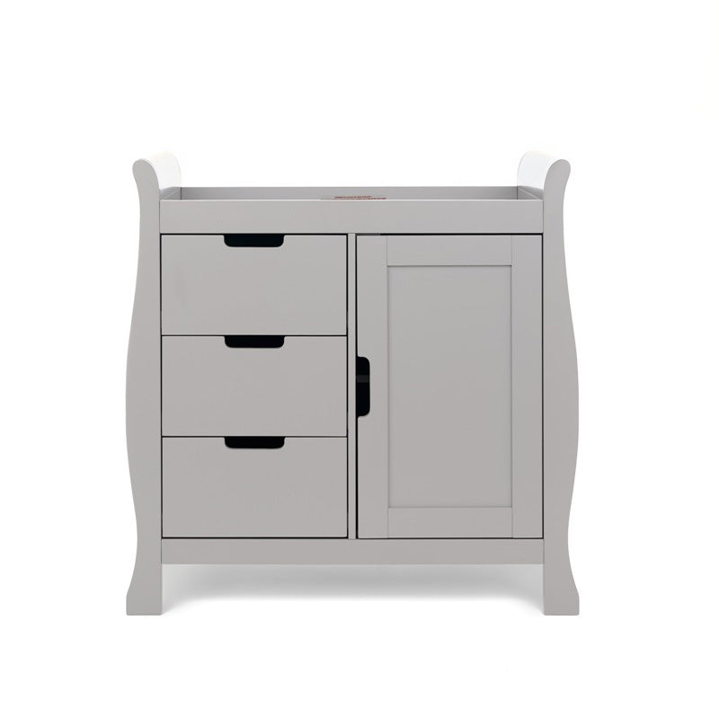 Sleigh changing unit with curved sides, left hand side has 3 drawers & right hand side has door, all with open cut out handles. 