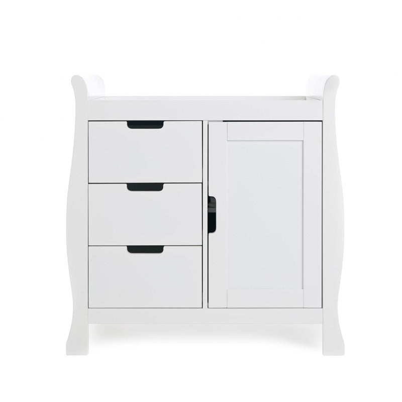 Slight changing unit, with curved sides, 3 drawers ont he left hand side & door on the right hand side all with cut out handles. 