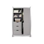 Sleigh double wardrobe with curved sides, left hand side has 3 display shelves with drawers underneath, right hand side has a full length door open showing 2 rails inside, all handles are open cut outs.