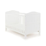 Traditional White Cot Bed with solid ends & rails on the side with teething rail.