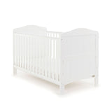 Traditional White Cot Bed with solid ends & rails on the side with teething rail.