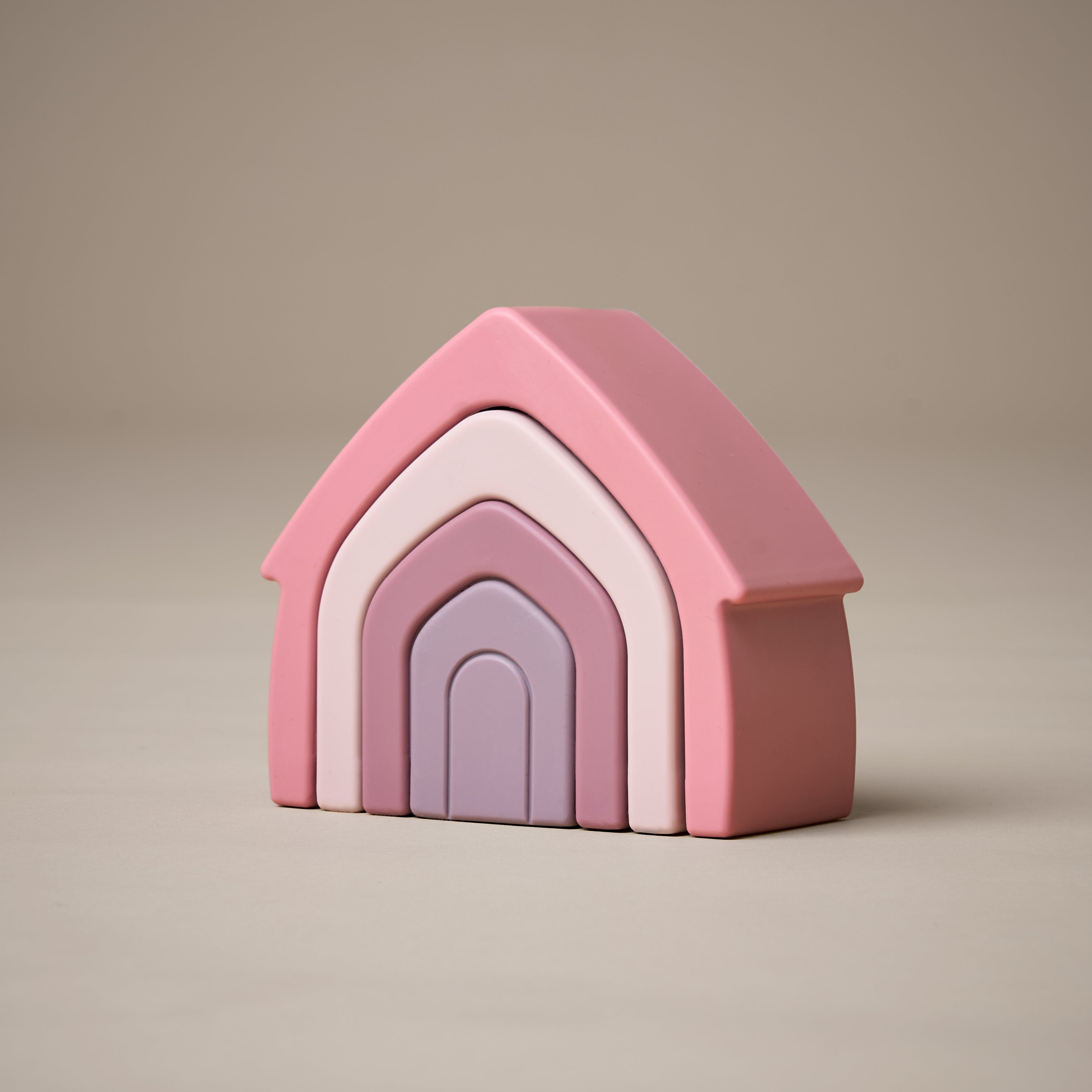 Stacked stacking house toy in purple and pink colours