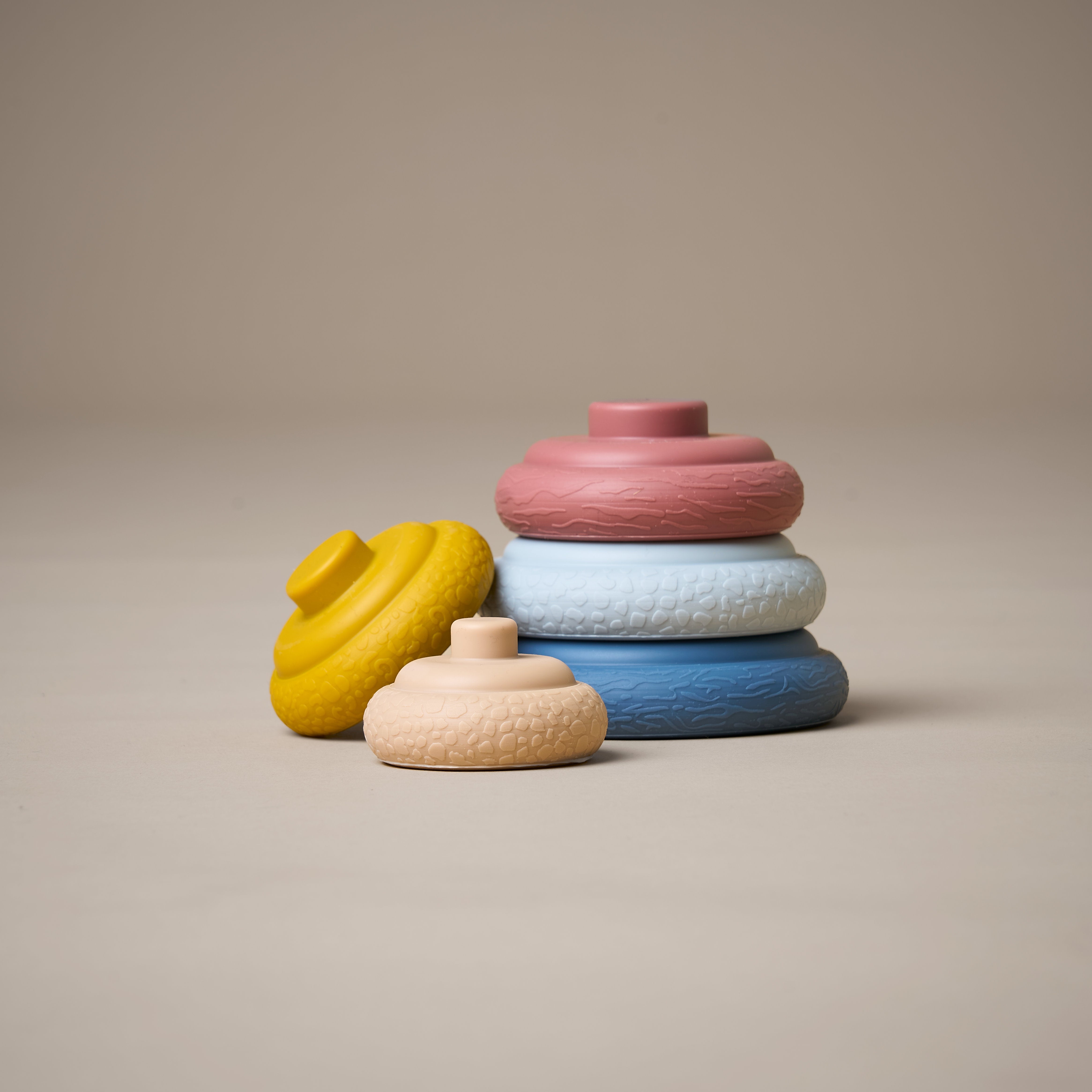 Stacking rings unstacked in a variety of different textures and colours