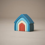 Stacked stacking house toy in orange, natural and blue colours