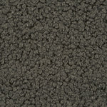 Close up of soft teddy fabric in dark green, olive tones 