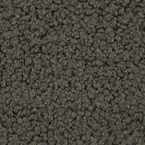 Close up of soft teddy fabric in dark green, olive tones 